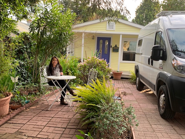 woman sitting in the courtyard of her home
