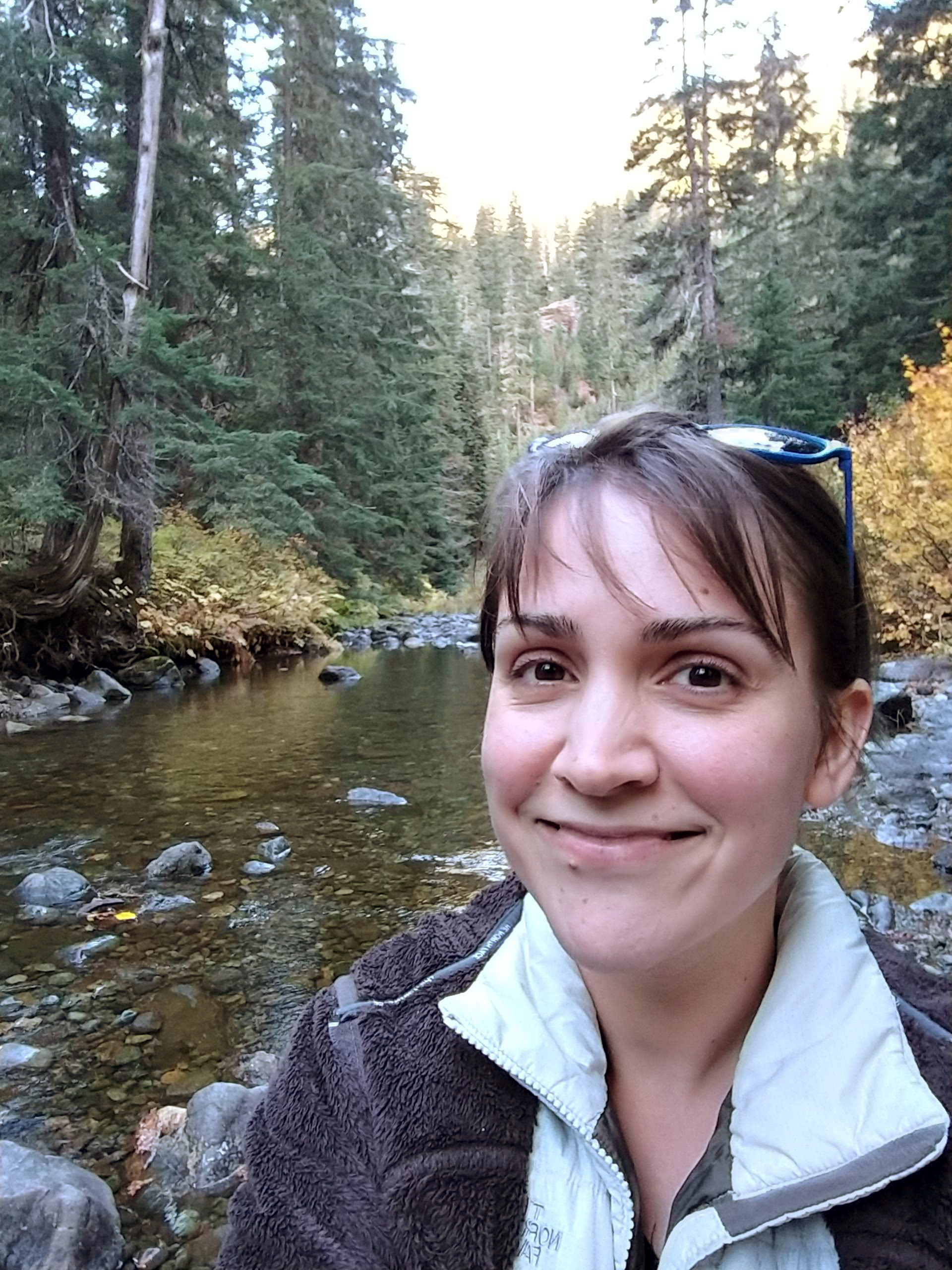Woman standing next to a river