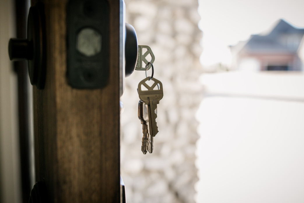 keys in front door of house