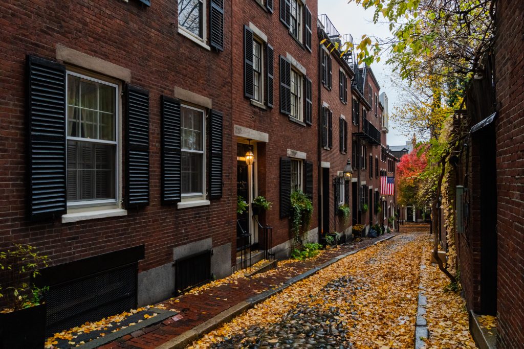 brown brick building near green trees during daytime