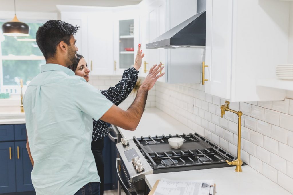 a real estate agent giving a client a house tour
