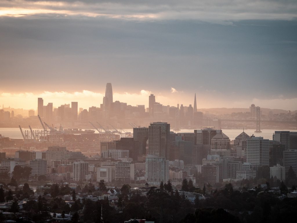 city skyline under orange sunset