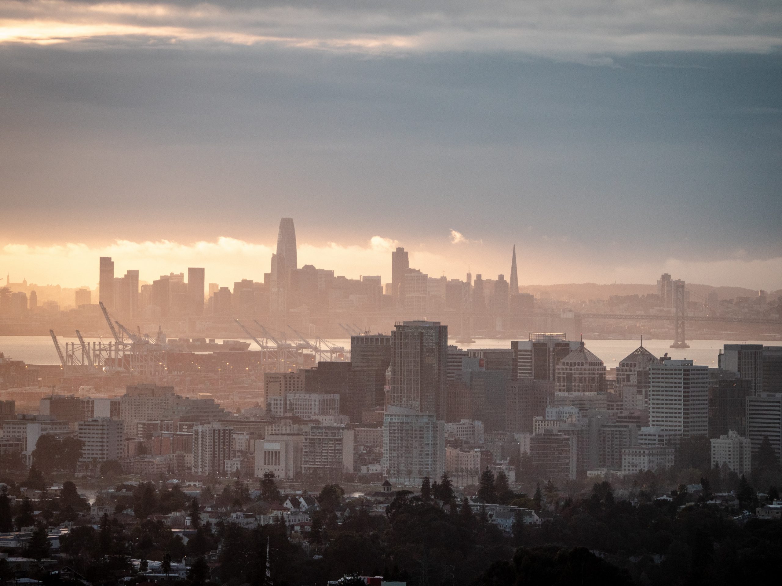 city skyline under orange sunset