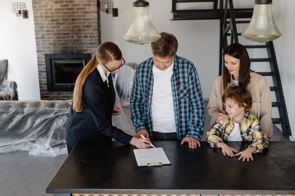 man signing a paper