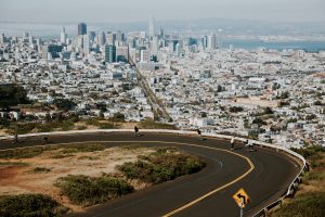 photo of people boarding down road