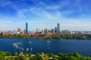 body of water near cityscape at daytime